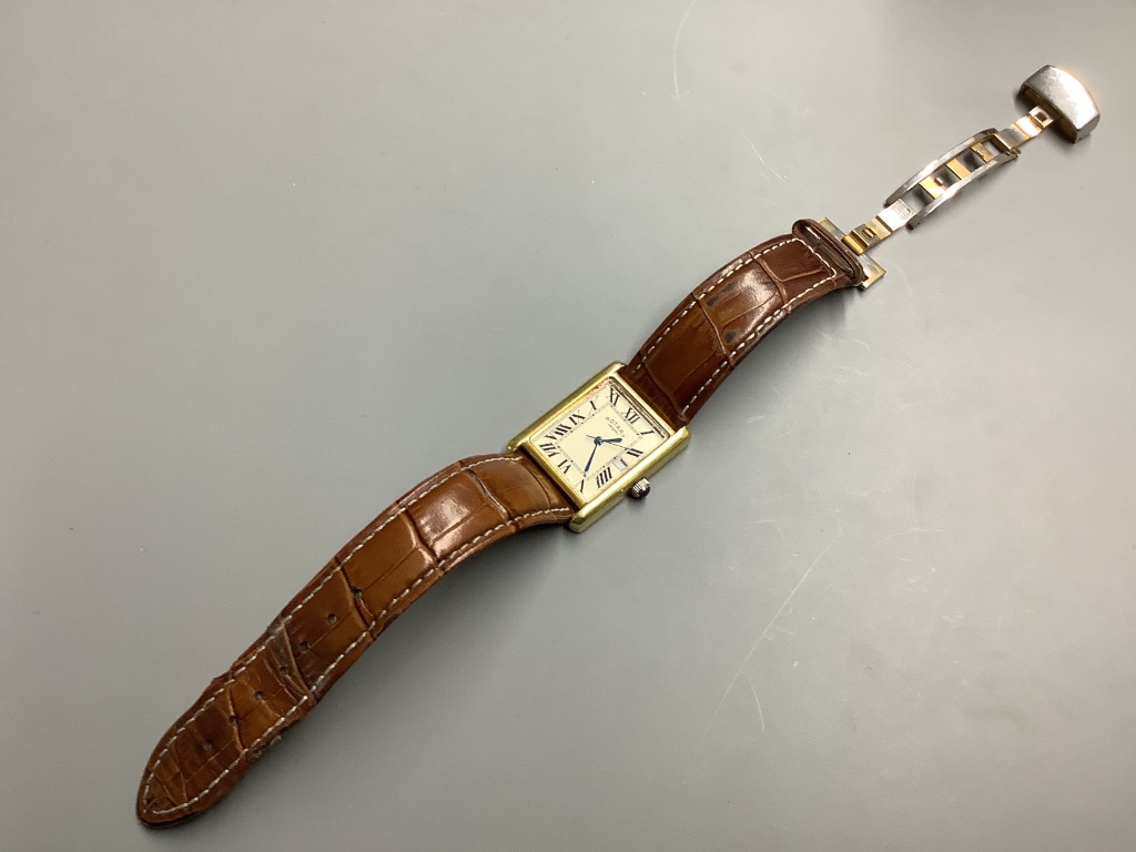 A gentleman’s gilt sterling Rotary quartz wrist watch, on a leather strap with rotary box.